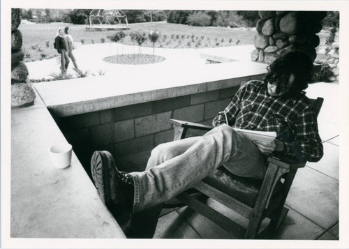 Student on Grove House porch, Pitzer College