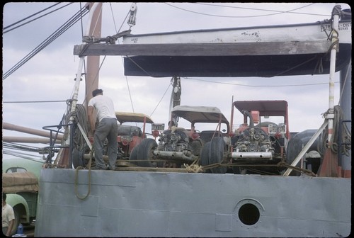 Loading dune buggy on freighter at La Paz
