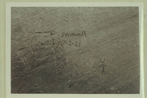 John Wetherill inscription. Mile 50.4 in Glen Canyon. In charcoal on petroglyph cliff