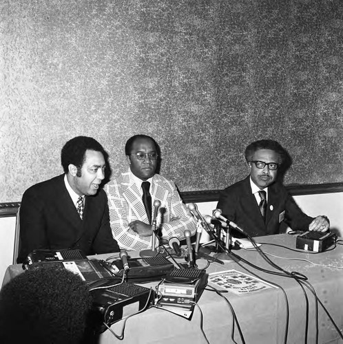 Man speaking at a press conference, Los Angeles, 1972