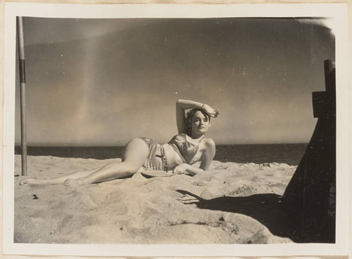 Woman posing on beach