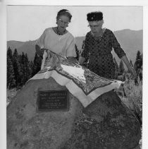 View of the dedication and plaque in stone for the site of Fort Janesville in Lassen County California. Bessie Wemple of Susanville, left and her sister Annie Bailey of Wendell, right unveil the marker. California State Landmark #758, Lassen County
