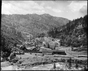 Panoramic view of a lumber mill in a valley in northern California