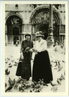 Gertrude Stein and Alice B. Toklas feeding pigeons in Venice, Italy, 1908