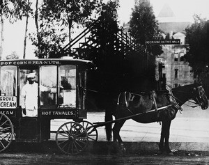 Tom, the Hot Tamales Man, and his horse drawn refreshment wagon, USC, 1910