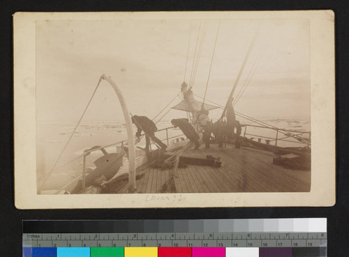 Unidentified ship. Men leaning over bow