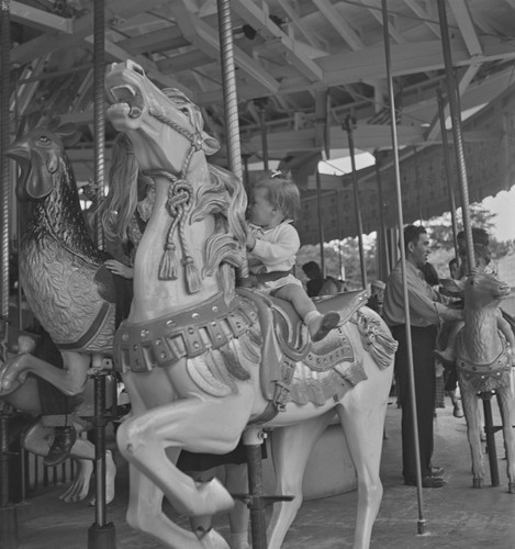 Girl running holding brother's hand, from Carousel, San Francisco