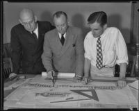 Gilbert Underwood, Carroll Pratt and Stephen Stack examine a map, Los Angeles, 1935