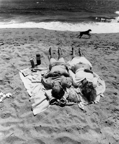 Couple lying on the beach