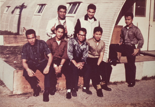 Navy Serivceman in Front of Hamoja Housing Barracks