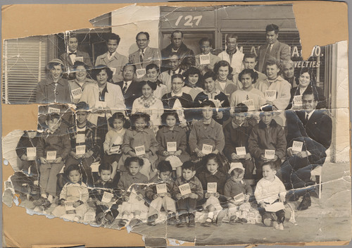 Group of Filipinos in Front of The Enterprise Owned by Domingo Dela Rosa Sr