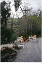 Flood debris along side a road. Possibly the 1998 El Nino Flood in California (2 copies)