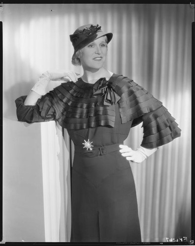 Peggy Hamilton modeling a navy blue dress in grenadine crepe, 1933