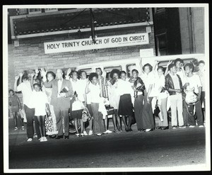 Group of students and others in front of a van, Holy Trinity COGIC, Chicago