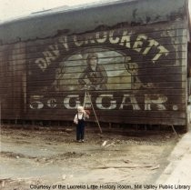 Bill Lescohier in front of Davy Crockett sign on Throckmorton Avenue, 1965