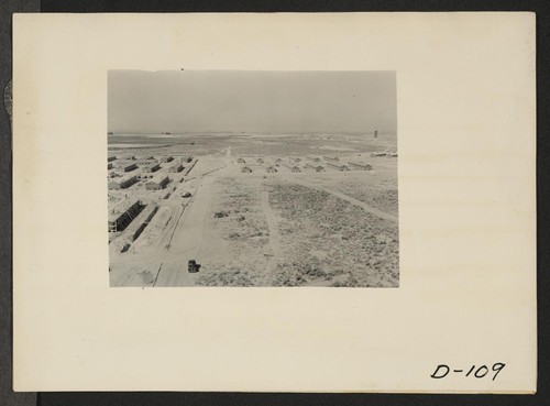 Eden, Idaho--A panorama view of the Minidoka War Relocation Authority center. This view, taken from the top of the water tower at the east end of the center, shows partially completed barracks. Photographer: Stewart, Francis Hunt, Idaho