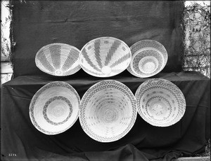 Six Indian baskets on display, ca.1900