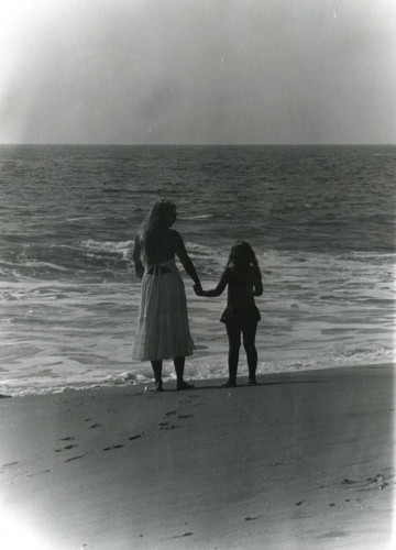 Woman and young girl on the beach in Malibu, 1978