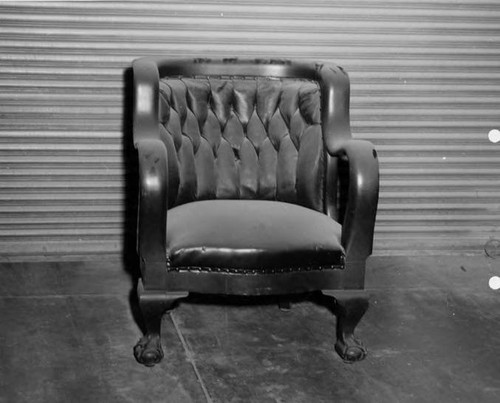 Antique chair with tufted upholstery