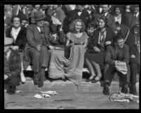 Spectators seated curb-side at the Tournament of Roses Parade, Pasadena, 1932