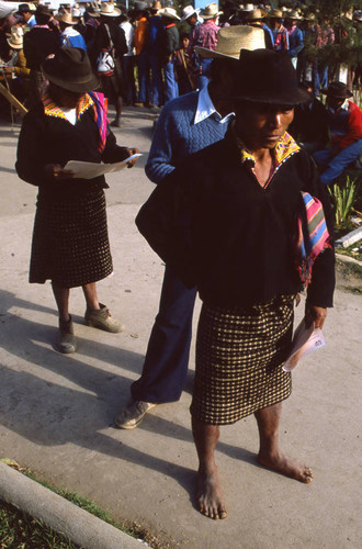 Mayan men holding their ballots on election day, Nahualá, 1983