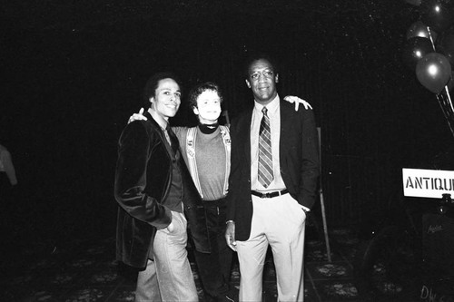 Bill Cosby posing with Leon Isaac Kennedy at a Neighbors of Watts benefit, Los Angeles, 1982