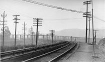 Railroad commuter train line, telephone poles, Richardson Bay, circa 1930's