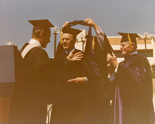 President Fords receiving honorary degree during Firestone Fieldhouse dedication, 1975