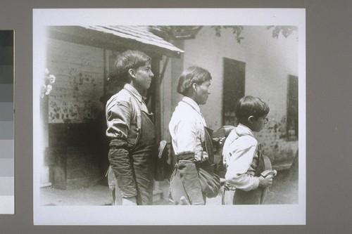 Three boys: Wilson Pratt, Hopi Sam (reservation shoemaker), Frank Davis -in reverse order, profile
