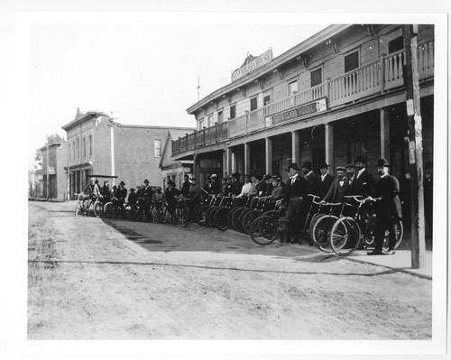 People on Bicycles in front of Santa Clara House in Ventura