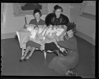 Mrs. Whitney Williams, Mrs. Gil McHaffie, and Mrs. Hilton McCabe sit with six babies, Los Angeles, 1936