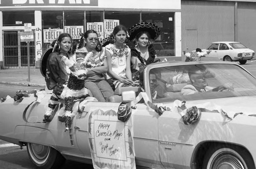 Cinco de Mayo parade participants riding in a convertible, Los Angeles, 1973