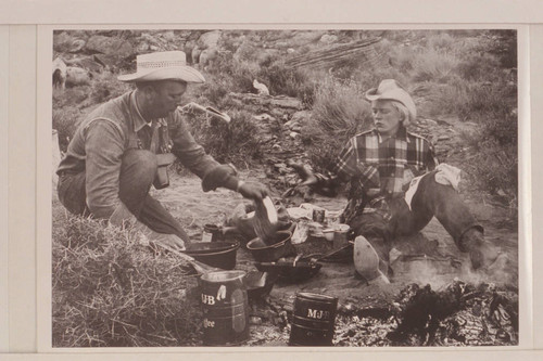 Bill Belknap and Nancy Daly bathe the dishes at camp in Navajo Canyon