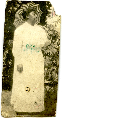 Woman holding a parasol in backyard