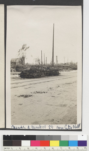 North of Market St. near City Hall. [Burnt remains of train car.]