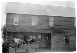 Riddell family seated in a truck in front of the Bodega Bay Store, about 1918