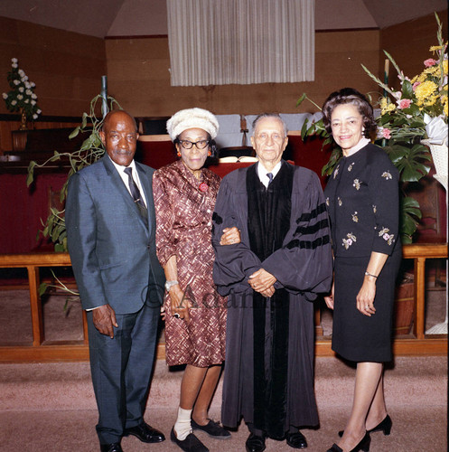 Minister with group at church altar, Santa Ana, 1973