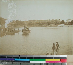Ferry and lakana on the river, forest region, Madagascar