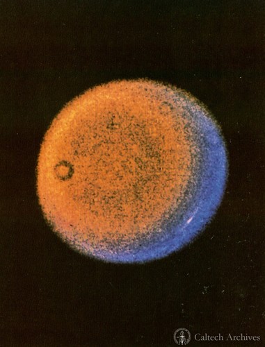 This false-color Voyager picture of Uranus shows a discrete cloud seen as a bright streak near the planet's limb. It is a highly-processed composite of three images