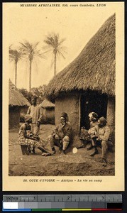 Men and women at the doorway of a house, Abidjan, Ivory Coast, ca.1900-1930