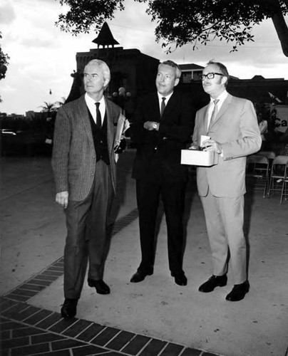 Owen Brady standing with two men in the Plaza