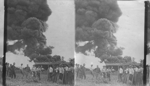 Burning of a 35,000 barrel tank of fresh crude oil on the Prairie Oil and Gas Co. tank farm at Jenk, Oklahoma, July 18, 1922
