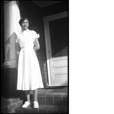 Woman standing on front porch