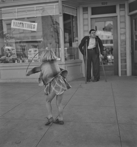 Girl skipping rope and cripple, Benicia