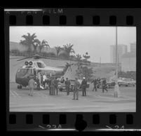 President Johnson and Lynda Bird exit helicopter in parking lot at Century Plaza. A. 1967