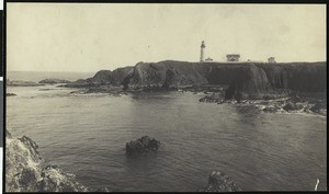 Lighthouse across a bay on the Oregon coast