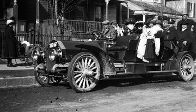 Thanhouser Company in automobile, going on location, 1911