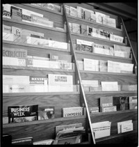 [Neyrpic Printed: a magazine rack with various business and engineering titles]