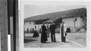 Three clergymen standing in front of the rectory at Carcha, Guatemala, ca. 1943
