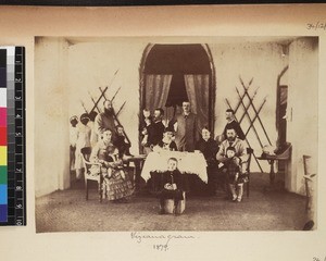 Group of missionaries, their wives and children at tea indoors, Vizianagaram, India, 1879